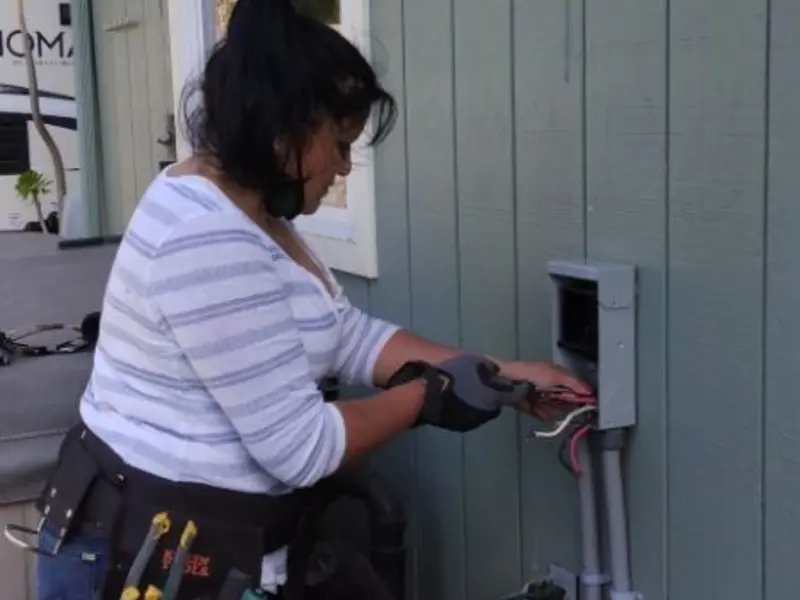 Licensed electrician wiring an exterior subpanel in Lake City